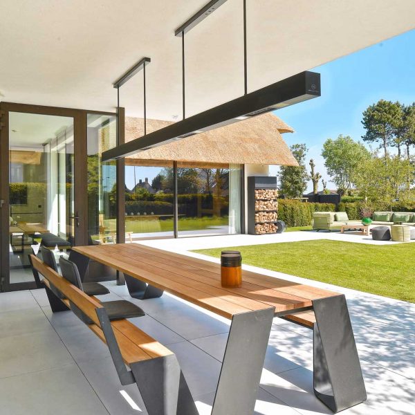 Image of large Heatsail BEEM outdoor ceiling heater above picnic table on chic outdoor terrace