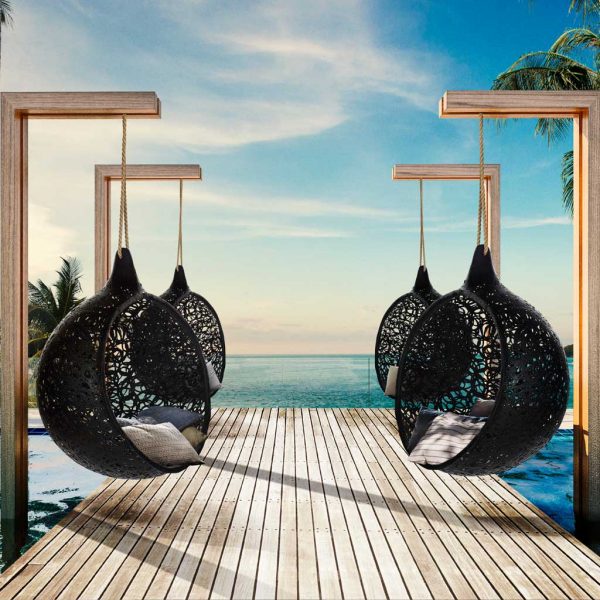 Image of 2 rows of Bios Mini black garden swing seats by Unknown Nordic, suspended from wooden stands on decking