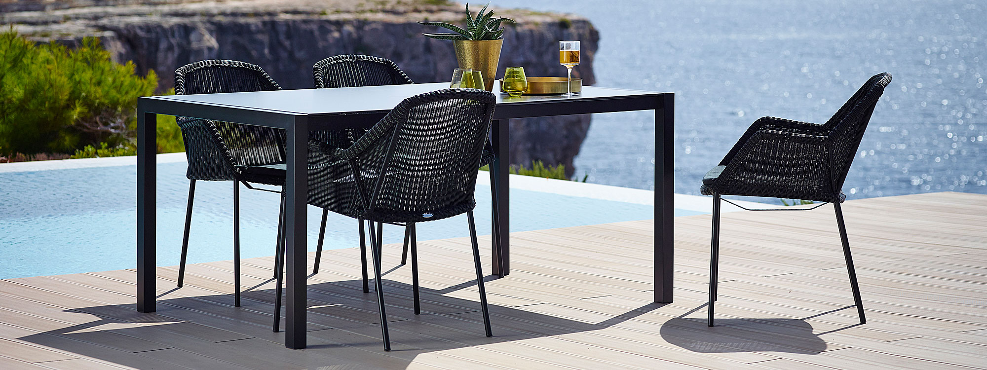 Stacking Breeze modern outdoor dining chair is a designer garden chair in high quality garden furniture materials by Cane-line luxury garden furniture