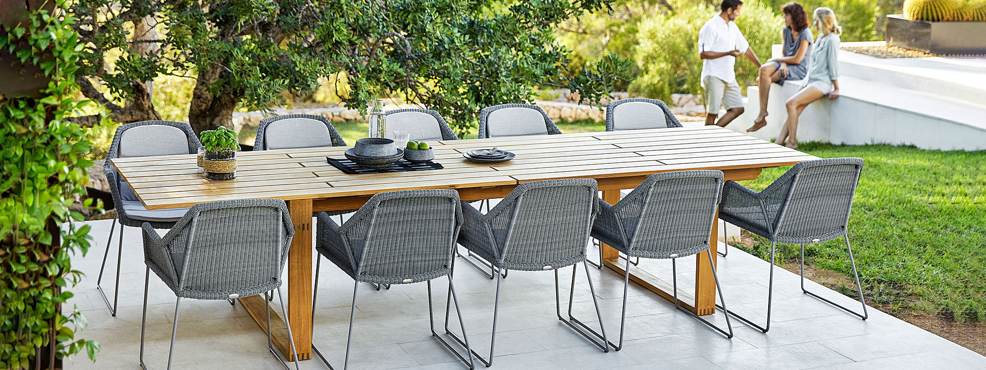 Image of terrace with light-grey Breeze woven garden chairs and Endless large teak table by Cane-line