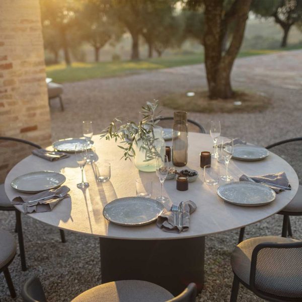 Branta round garden dining set in early evening sunlight