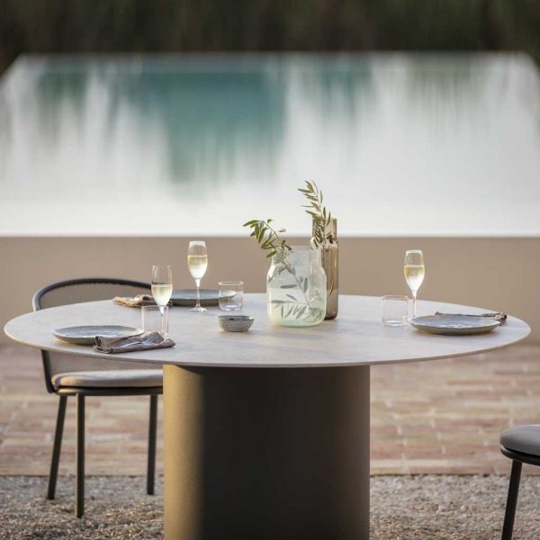 Branta circular garden table is a modern garden dining table in high quality outdoor furniture materials by Todus garden furniture company