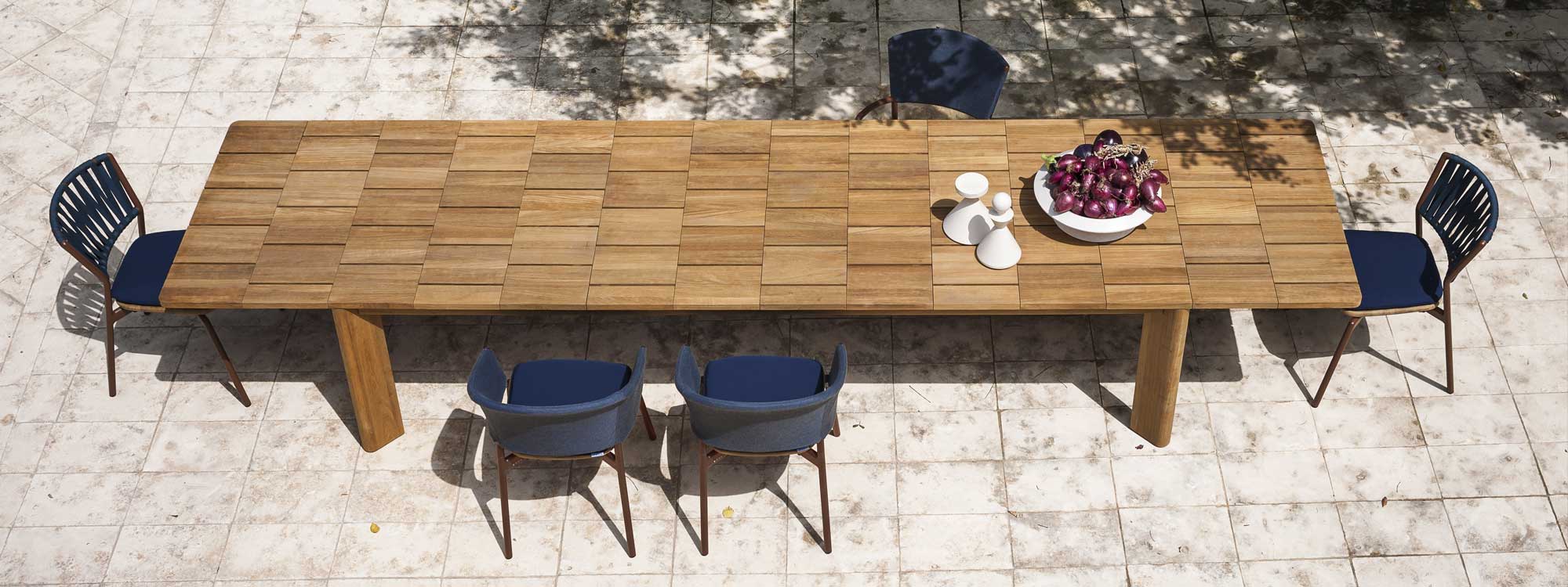Brick extending garden dining table & solid teak outdoor table in high quality exterior furniture materials by RODA luxury outdoor furniture