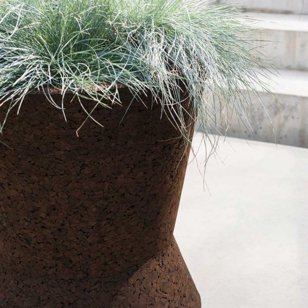 Image of RODA Bush On brown cork plant pot which has geometric hour-glass form