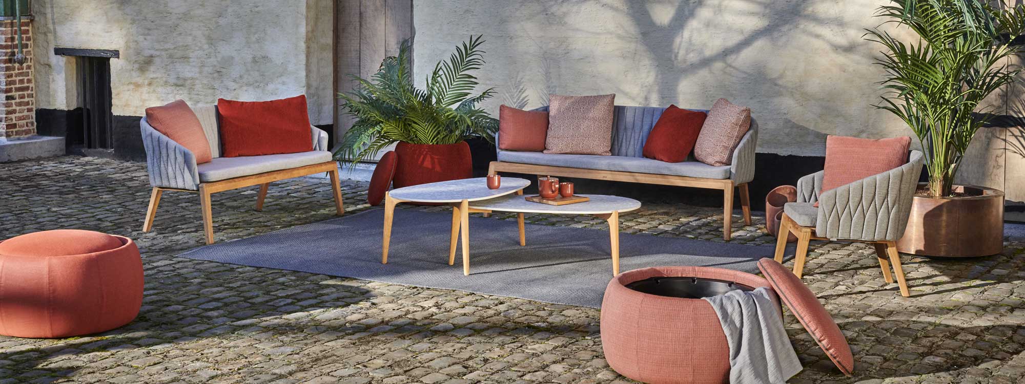 Image of Royal Botania Calypso garden sofa and Tea Time exterior low tables on terrace