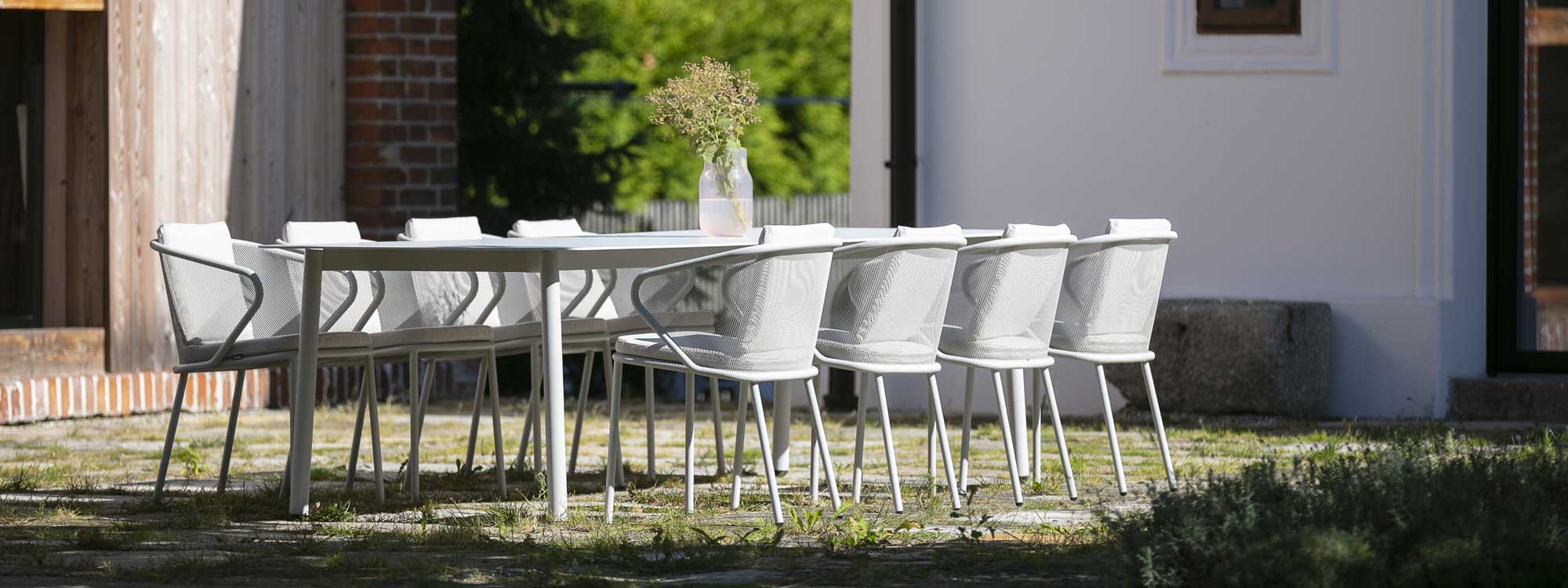Condor modern outdoor dining set has curvaceous design by Studio Segers for Todus stainless steel furniture