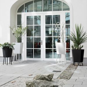 Elevation modern planter is a raised plant pot on legs with indoor/outdoor aluminium planting insert by Flora galvanised steel planter company