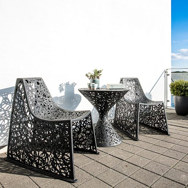 Image of pair of black X garden chairs on terrace by Unknown Nordic furniture