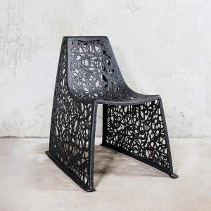 Image of black X chair by Unknown Nordic shown against concrete background