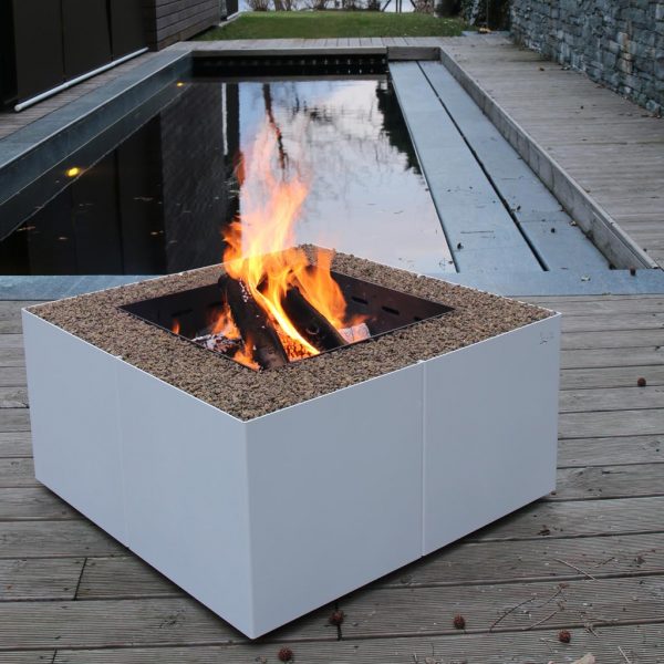 Image of Dado geometric fire pit by AK47 on decking beside tranquil water feature