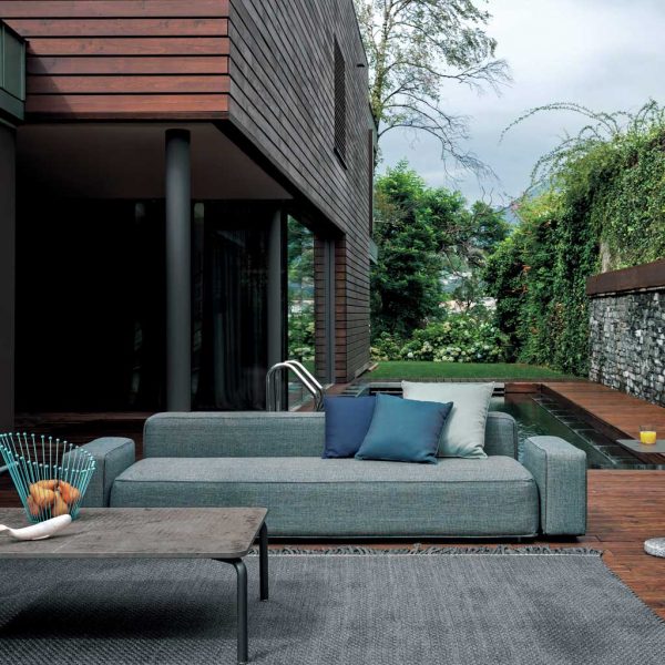 Image of RODA Dandy grey outdoor sofa shown on decking next to swimming pool