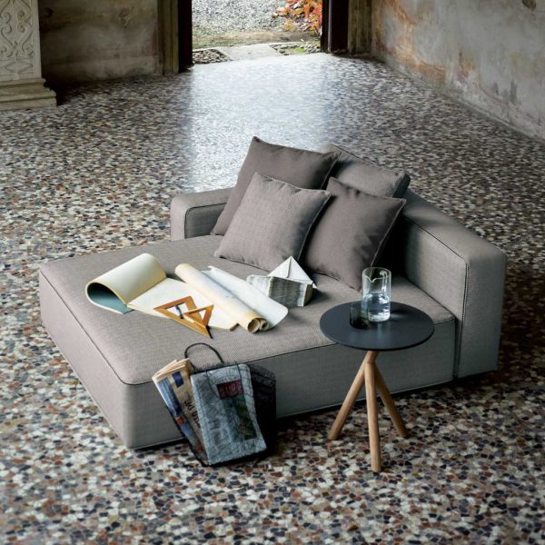 Grey Dandy garden chaise longue shown on mosaic floor