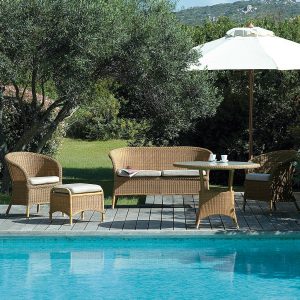 Image of Caneline Derby synthetic rattan furniture on poolside