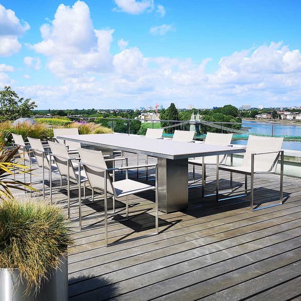 Image of Doble large garden dining set on London rooftop terrace with river Thames and bridge in the background