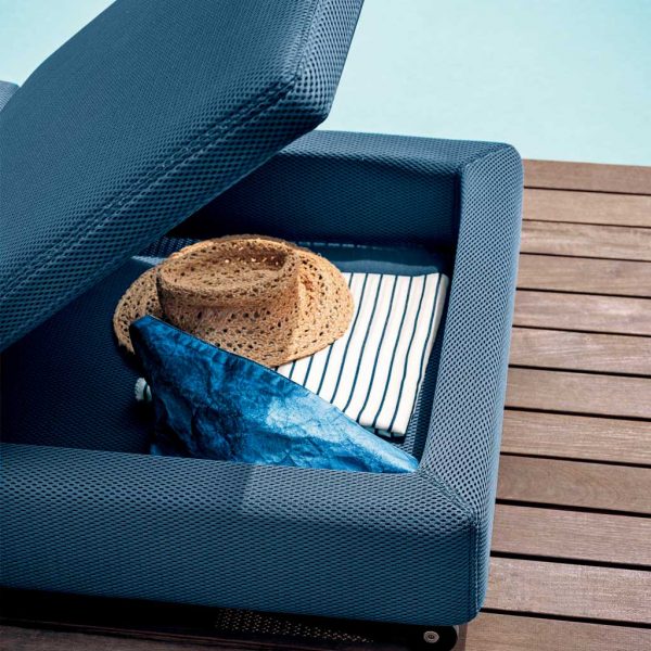 Double upholstered sun lounger & its storage area beneath the headrest