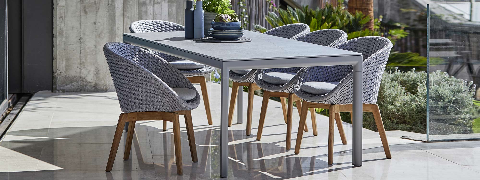 Image of light-grey Drop ceramic garden table with light-grey and teak Peacock chairs by Cane-line
