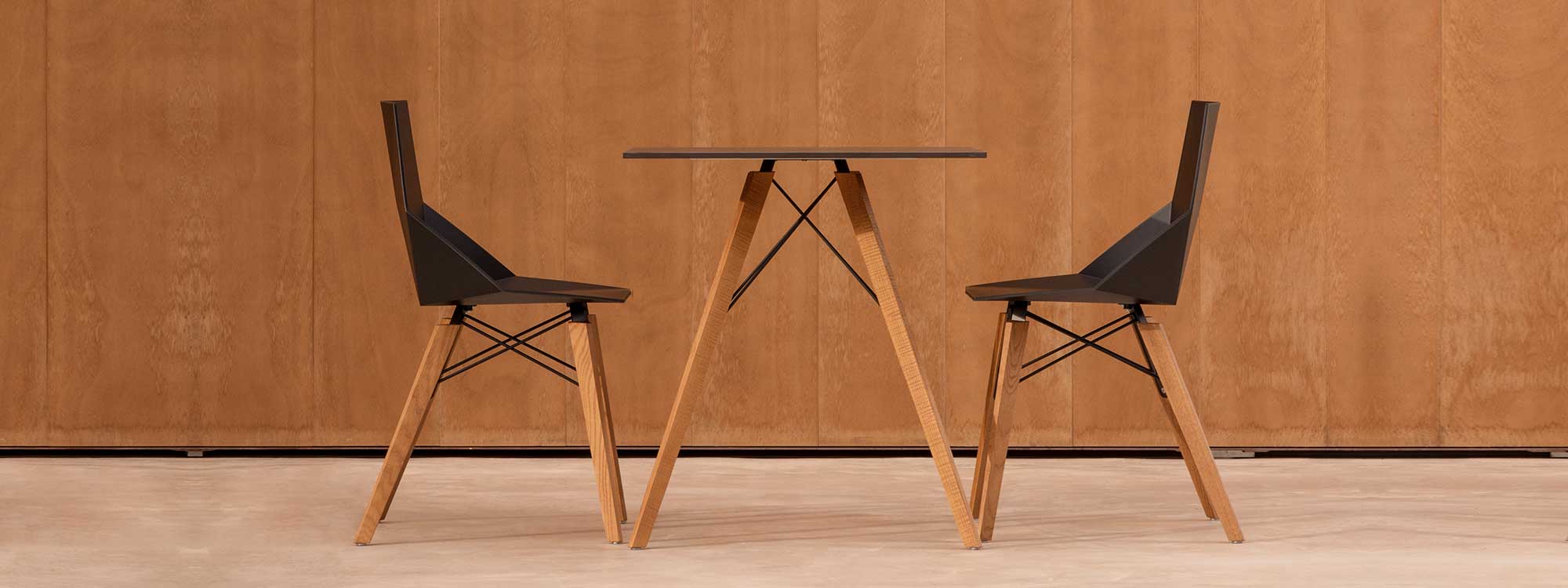 Image of Vondom Faz Wood indoor bistro table and chairs with beech legs and black surfaces