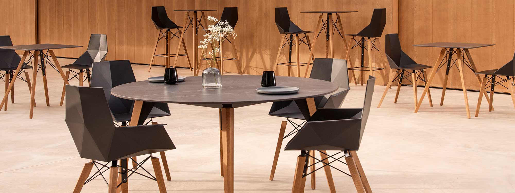 Image of Vondom Faz Wood minimalist dining table and chairs with beech legs and black surfaces