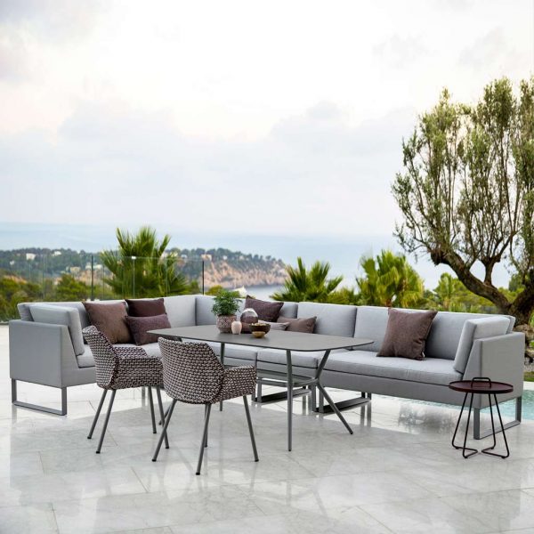 Joy Table & Vibe Chairs With Flex outdoor dining lounge furniture is a modular modern garden sofa in all-weather garden furniture materials by Cane-line luxury exterior furniture