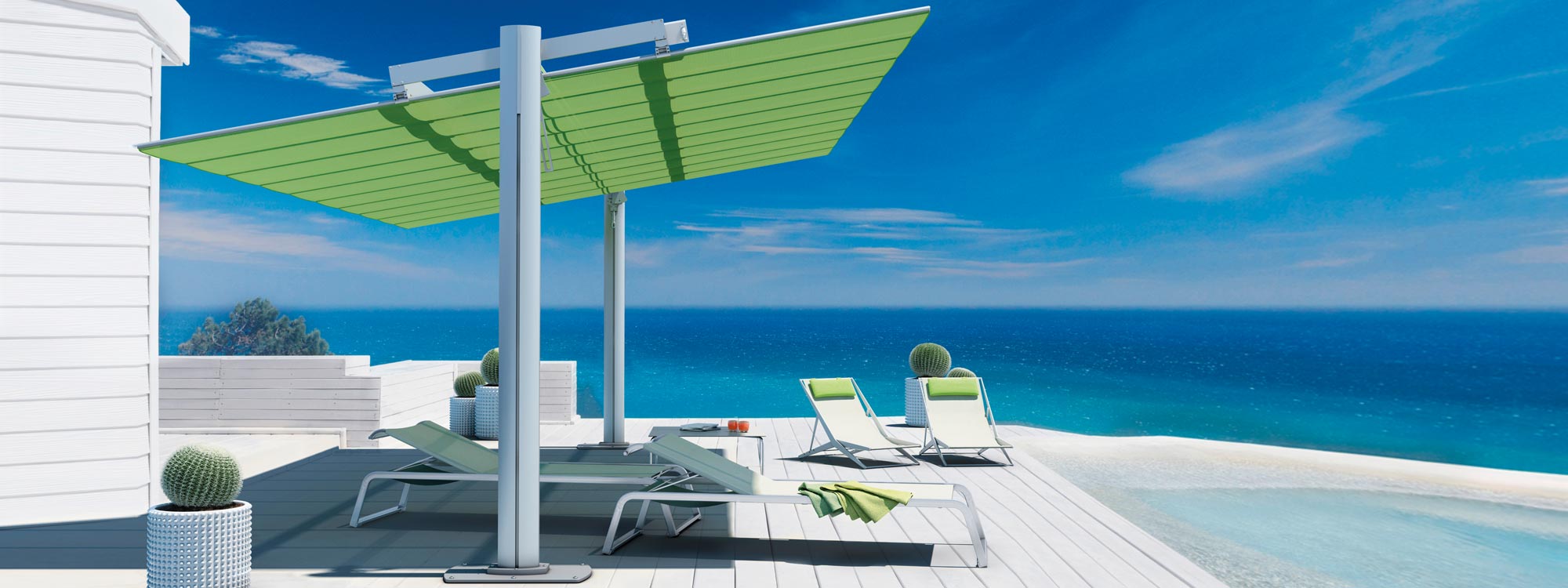Image of Flexy Large freestanding sun shade over Coro L3 loungers and Boomy chairs on sunny terrace with azure sea in background
