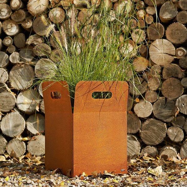 Image of Box rusted corten steel plant pot planted with green architectural grasses