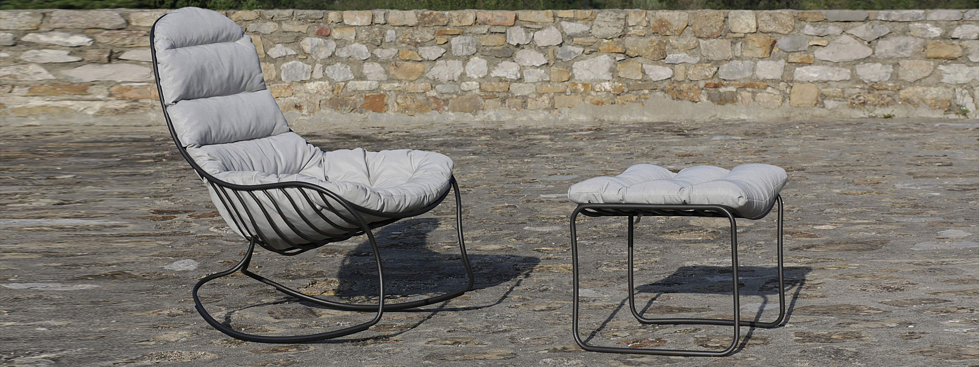 Image of black Folia outdoor rocker and footstool in anthracite with grey cushions by Royal Botania