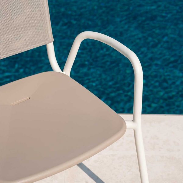 Image of detail of white tubular aluminum frame and taupe seat and back of RODA Guest garden chair on poolside