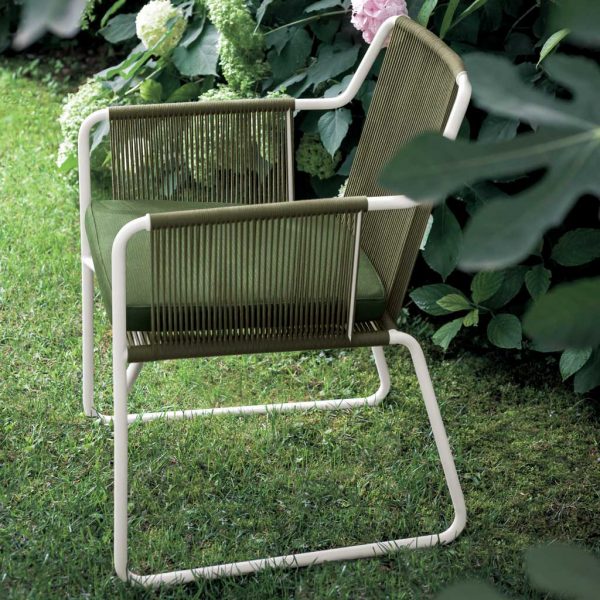 Image of RODA Harp garden chair with Milk frame and Sand cords on grassy lawn with Hydrangeas in background
