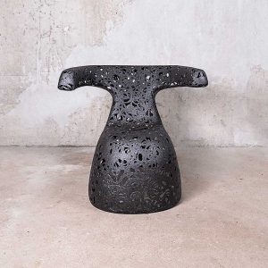Image of Hug black garden chair by Unknown Nordic against concrete background