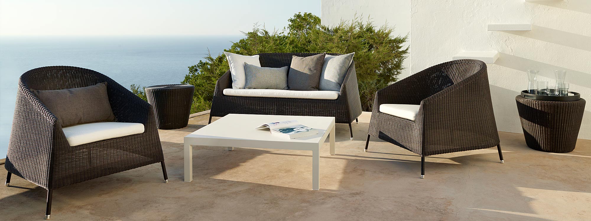 Image of pair of Kingston garden relax chairs an Kingston 2 seat garden sofa in mocca finish by Caneline