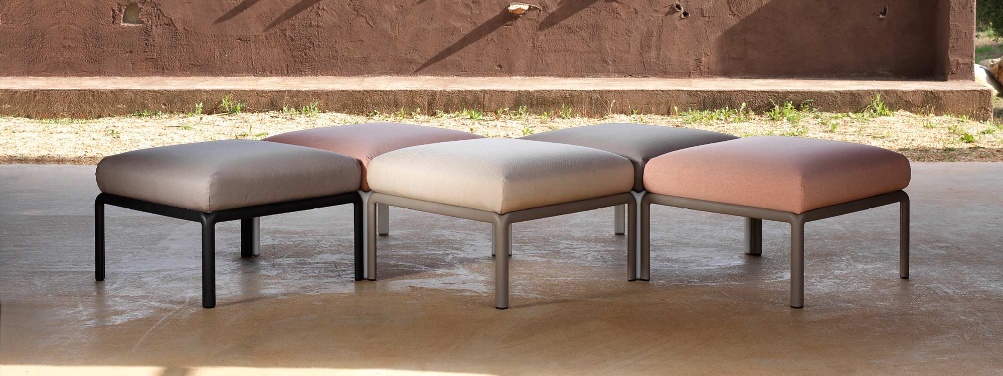 Image of 4 Komodo outdoor ottomans in different colours placed together