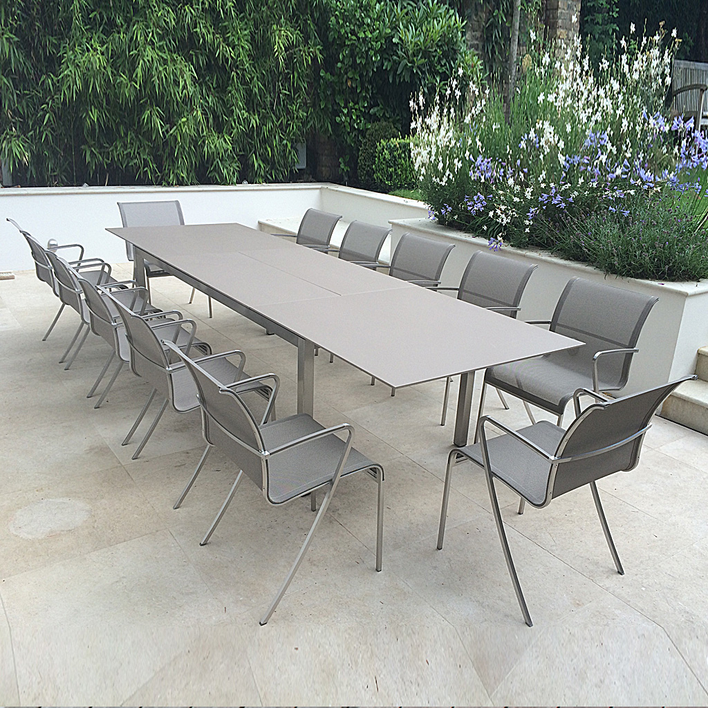 Image of UK installation of Taboela extending garden table and QT55 chairs in Sand finish by Royal Botania