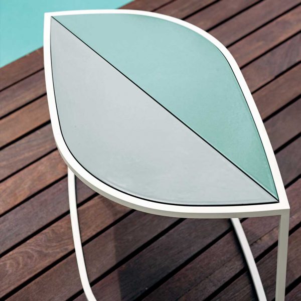 Image of White Leaf table with Gres ceramic top on decking next to swimming pool