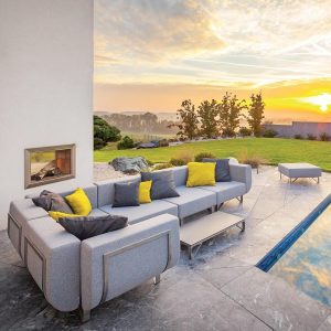 Image of Todus Lotos modern garden sofa on terrace as sun sets in distance