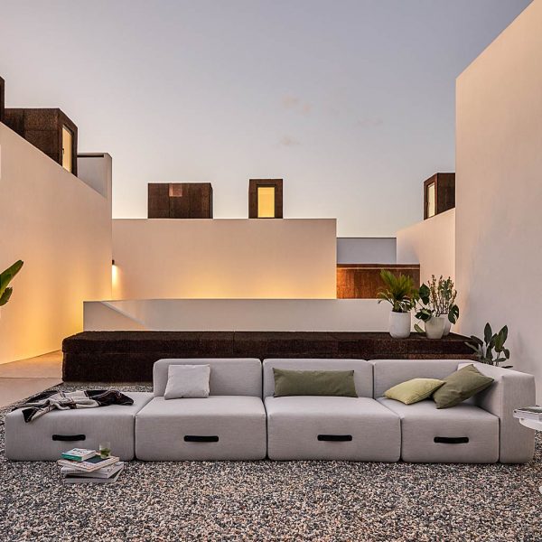 Image at Dusk Of Miami MODERN GARDEN Furniture SOFA In Portugal white-washed courtyard