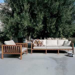 Mistral 3 seat teak sofa and lounge chair with White cushions on Mediterranean terrace