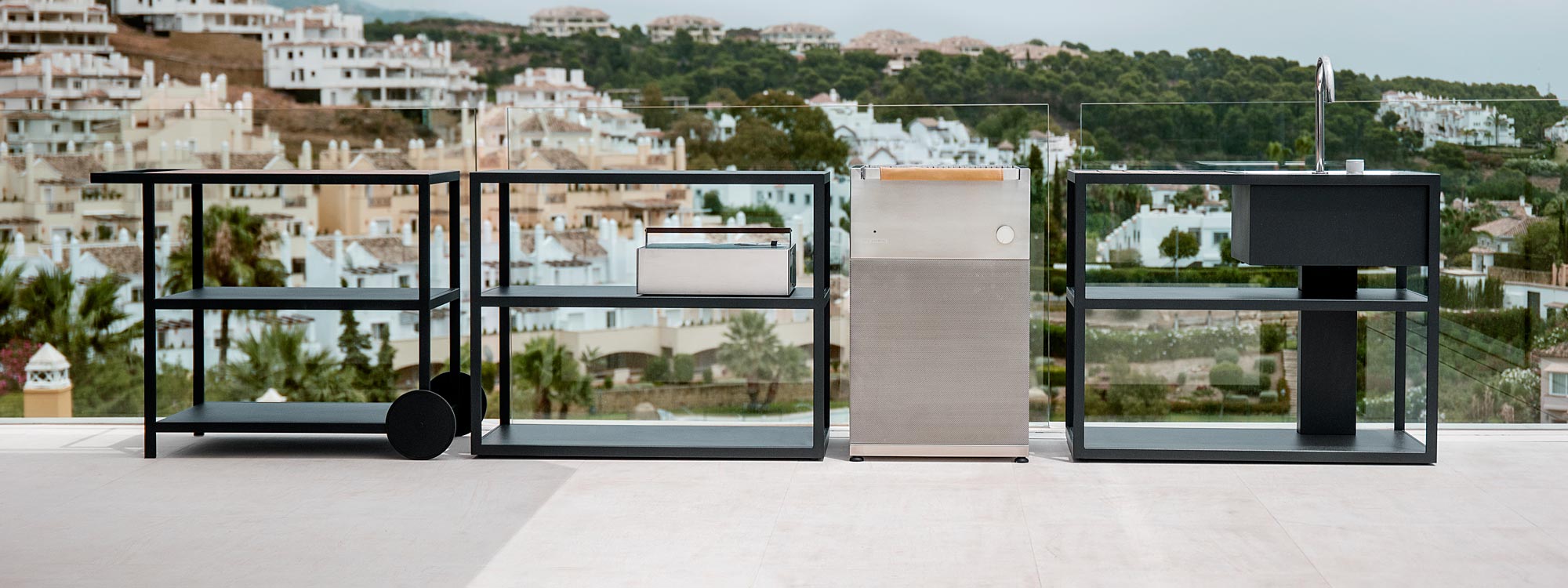 Image of Roshults Booster BBQ Grill on terrace in Southern Spain with villas in background on hillside