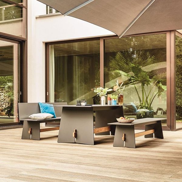 Image of Tension zen-inspired picnic table and bemches in anthracite HPL and iroko, by Conmoto - Germany