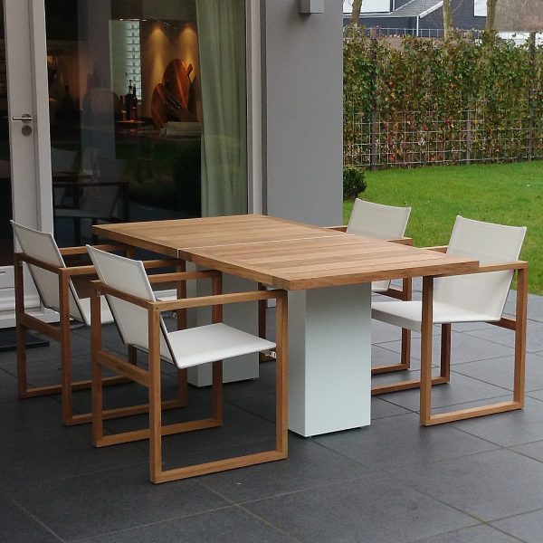 Image of Doble white pedestal garden table with teak top and Butaque teak garden chairs by FueraDentro