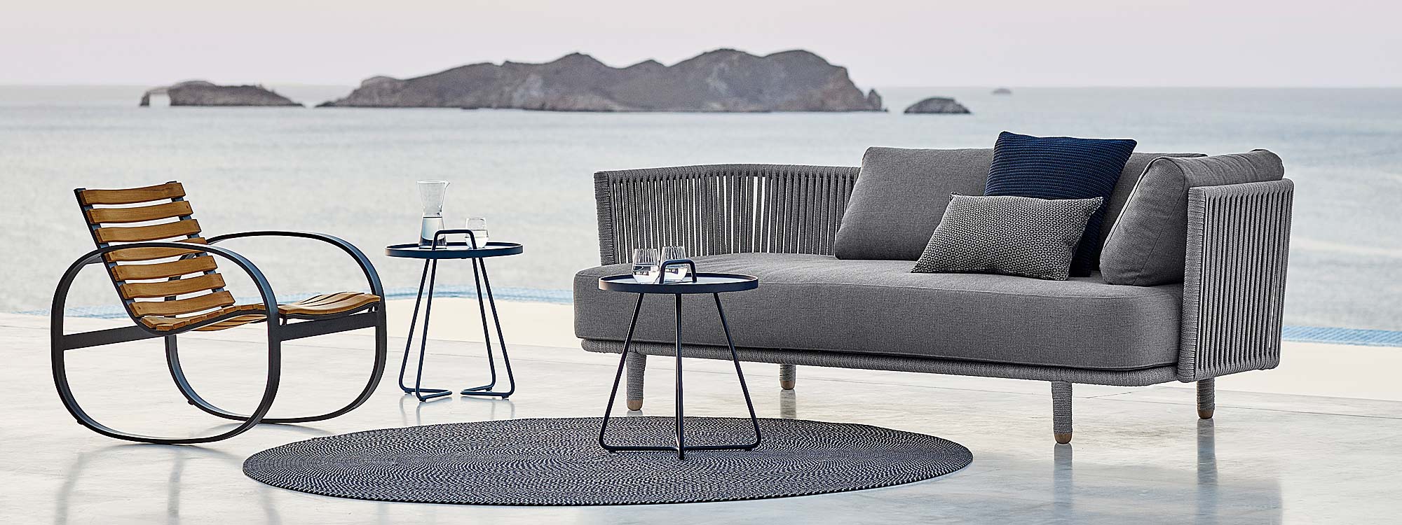 Moments modern garden sofas is a luxury outdoor lounge set in high quality garden furniture materials by Cane-line all-weather outdoor furniture