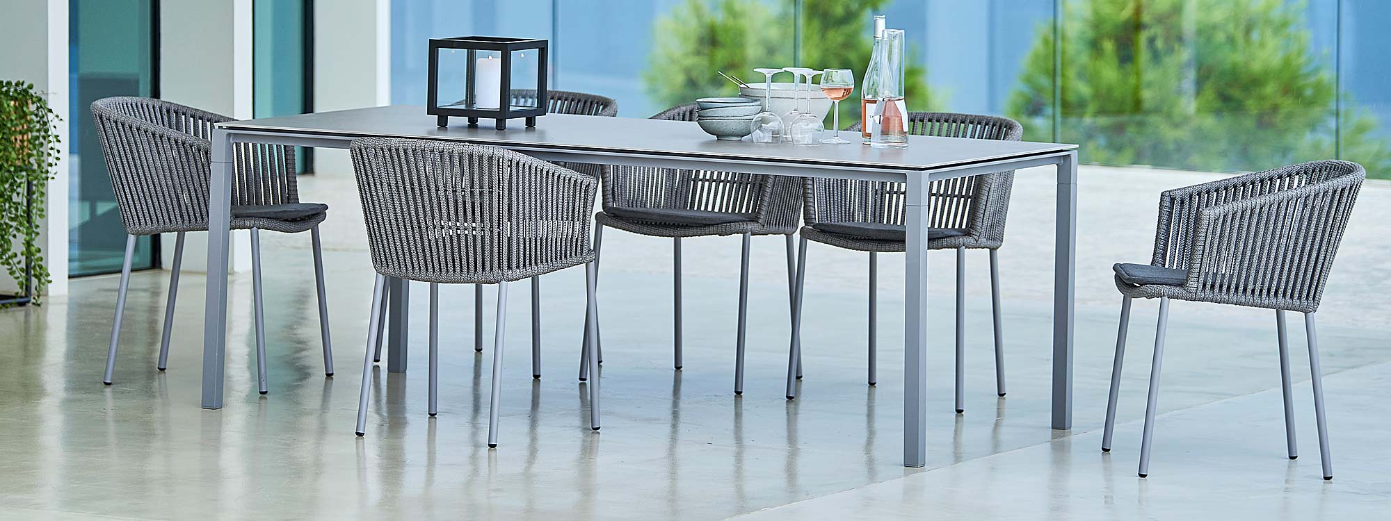 Image of light grey Pure ceramic garden table and Moments outdoor chairs in light-grey Soft Rope by Cane-line