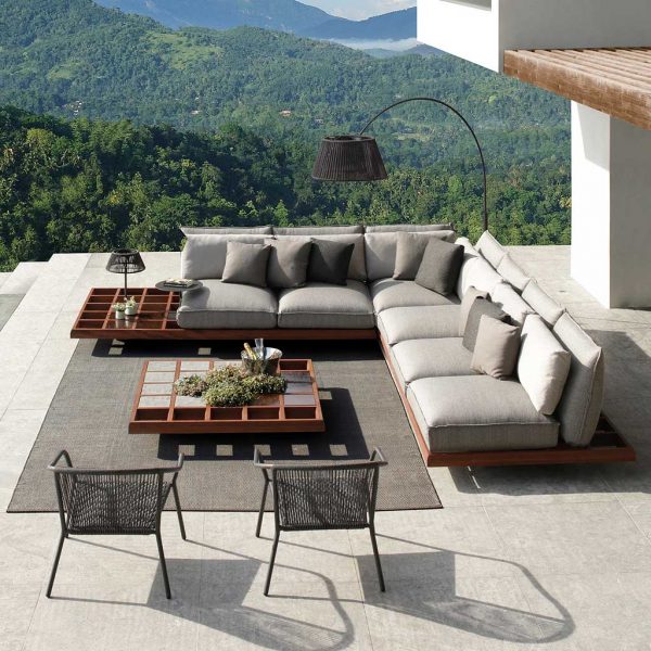 Image of Royal Botania Mozaix corner sofa and Samba lounge chairs with hills and valleys of woodland stretching into the distance.