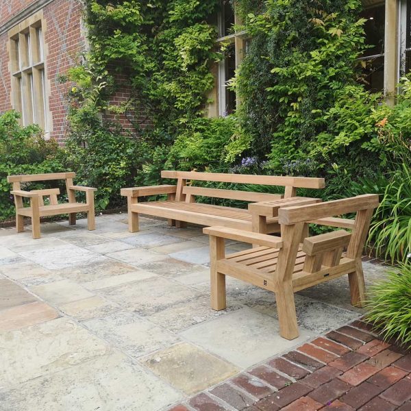 Royal Botania Nara teak garden sofas in English garden courtyard