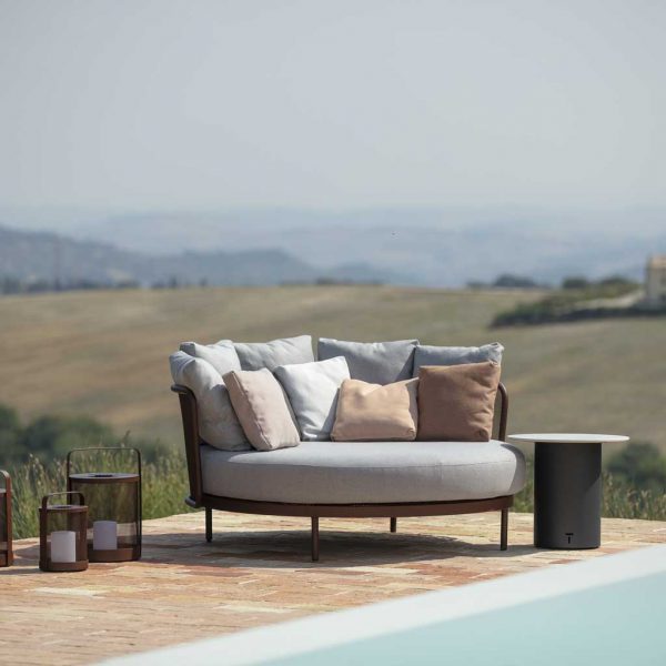 Image of Todus outdoor daybed on poolside with scorched Portuguese countryside in the background