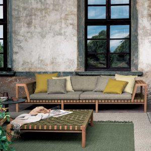 Image of RODA Network teak sofa with grey, yellow and ecru cushions, together with Network outdoor ottoman with green webbing