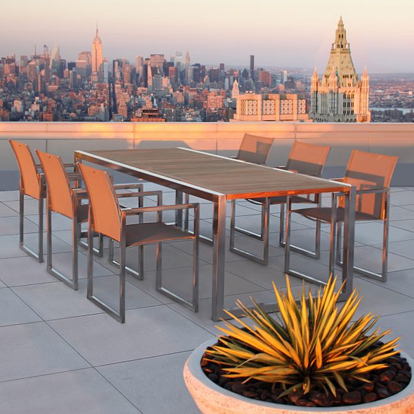 Image of Royal Botania teak Ninix dining table and chairs on city rooftop terrace