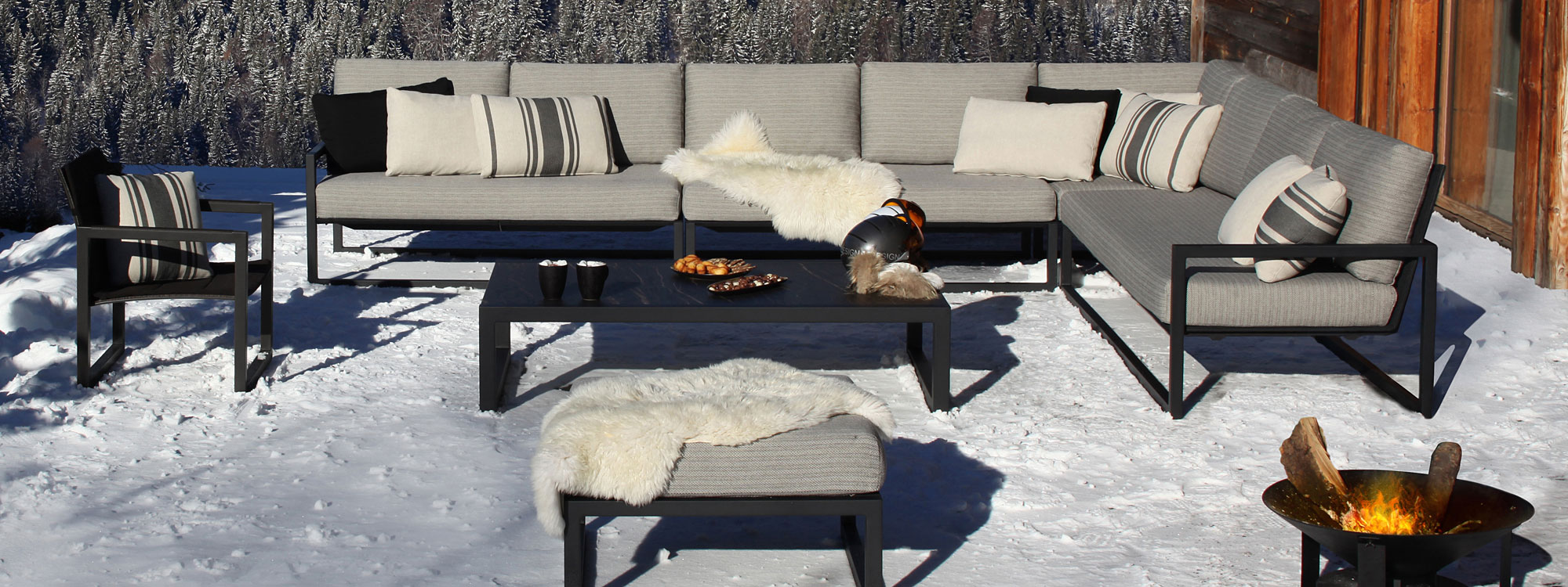 Image of black Ninix furniture with grey upholstery on snowy terrace from Encompass Furniture