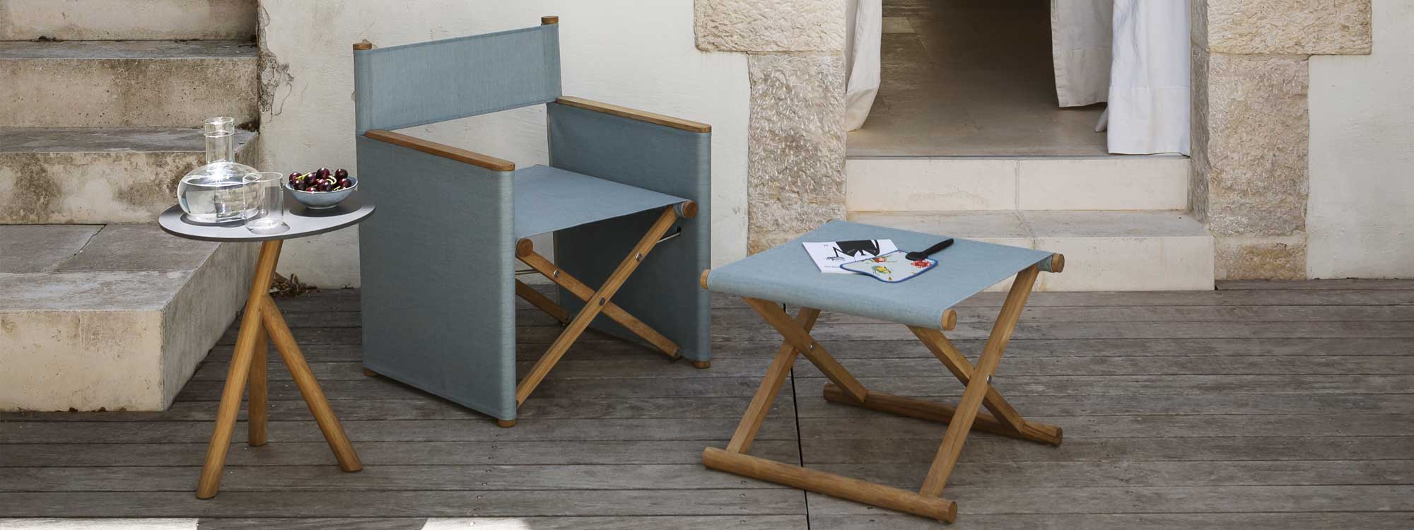 Image of RODA Orson folding garden lounge chair with folding foot rest in teak and grey Batyline, together with Stork teak side table