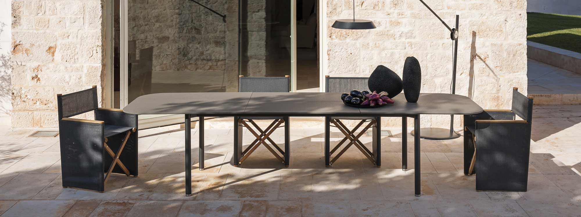 Image of Orson modern outdoor director chairs and Piper extending garden table by RODA