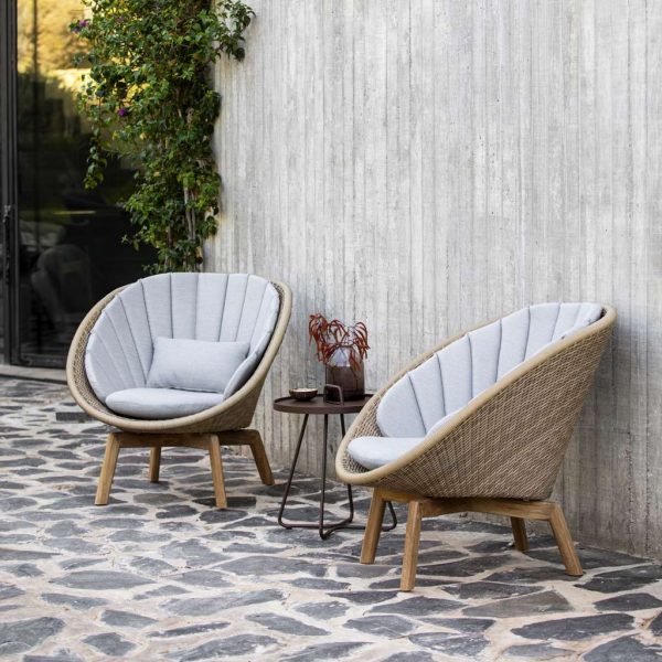 Natural Rattan-Finish Peacock garden easy furniture includes a designer 2 seat garden sofa & modern outdoor lounge chair in all-weather furniture materials by Cane-line.